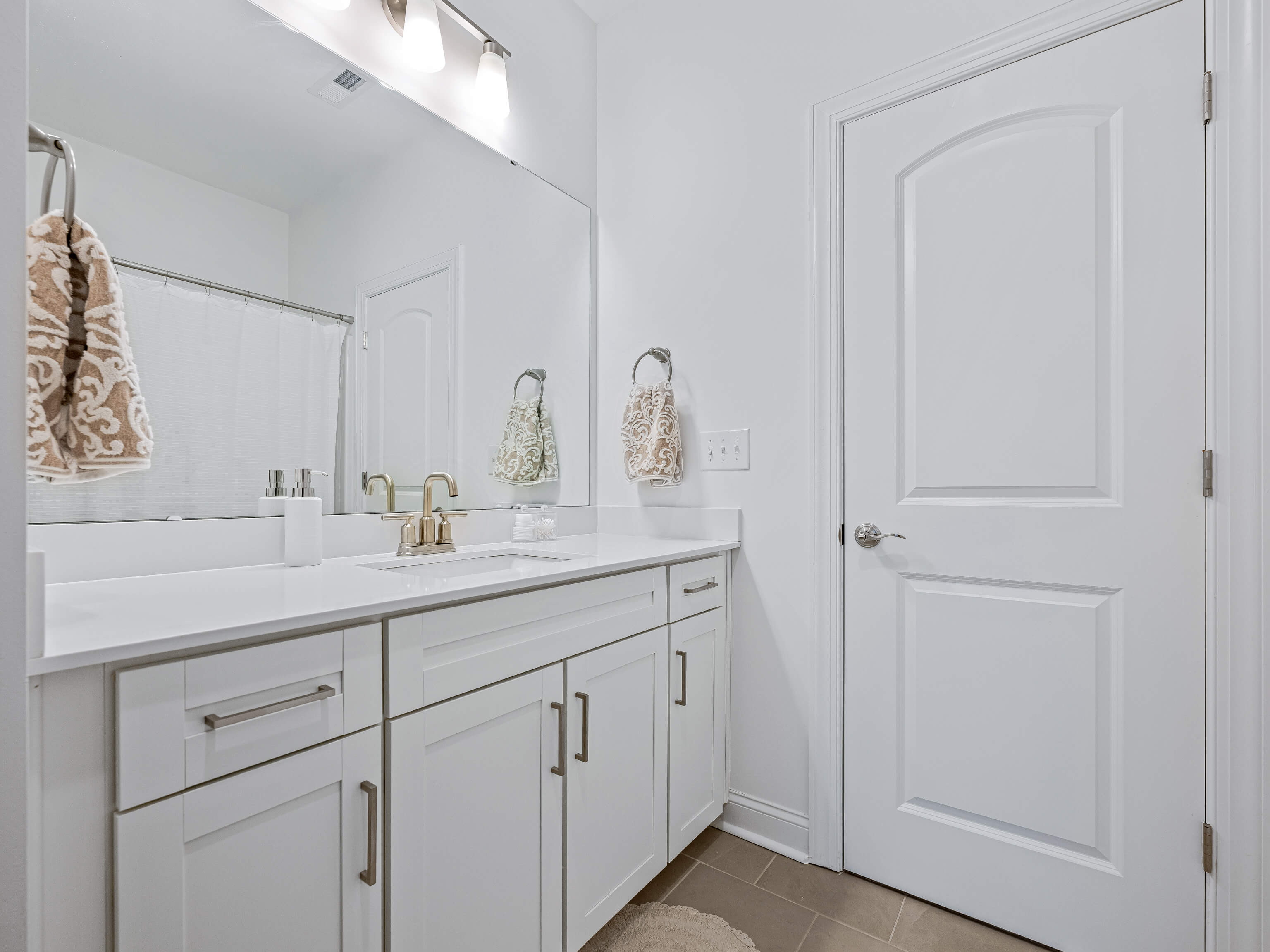 Additional bathroom with gold fixtures