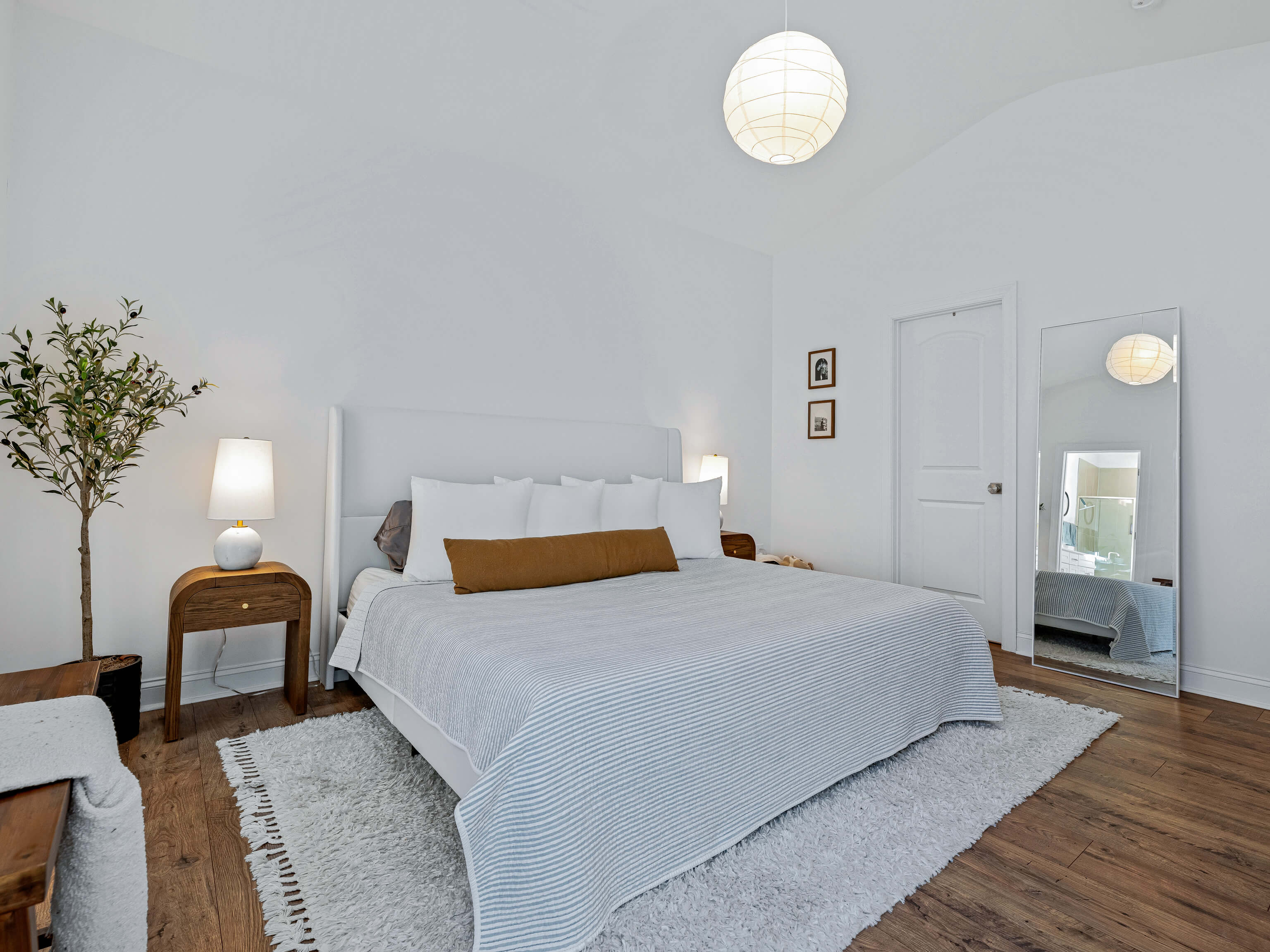Secondary bedroom with wood floors