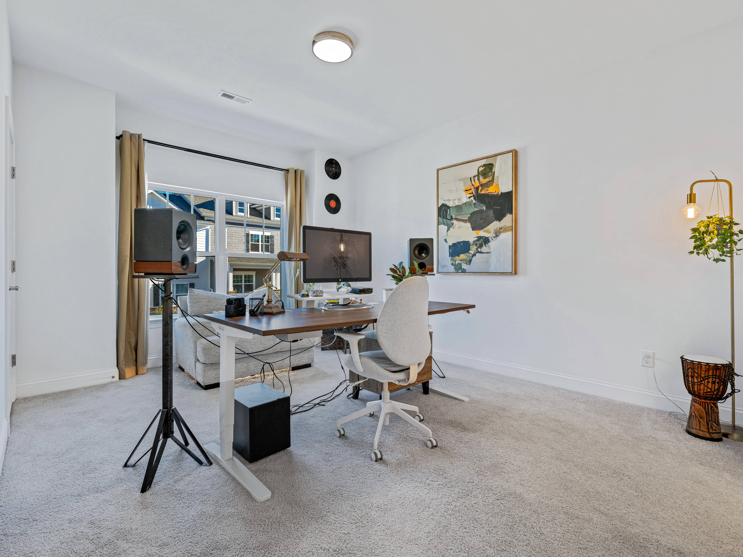 Home office with modern desk setup and professional lighting